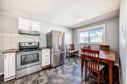3-4503 75 Street Nw, Calgary, AB - Indoor Photo Showing Kitchen With Stainless Steel Kitchen