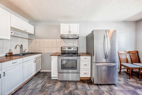 3-4503 75 Street Nw, Calgary, AB - Indoor Photo Showing Kitchen With Stainless Steel Kitchen With Double Sink With Upgraded Kitchen