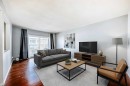 3-4503 75 Street Nw, Calgary, AB  - Indoor Photo Showing Living Room 