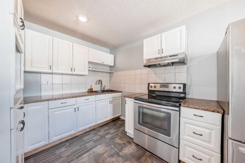 3-4503 75 Street Nw, Calgary, AB - Indoor Photo Showing Kitchen With Stainless Steel Kitchen