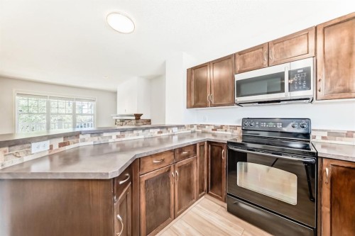 137 Eversyde Boulevard Sw, Calgary, AB - Indoor Photo Showing Kitchen With Double Sink