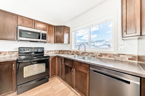 137 Eversyde Boulevard Sw, Calgary, AB - Indoor Photo Showing Kitchen With Double Sink
