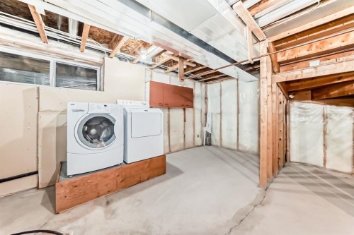 137 Eversyde Boulevard Sw, Calgary, AB - Indoor Photo Showing Laundry Room