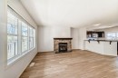 137 Eversyde Boulevard Sw, Calgary, AB  - Indoor Photo Showing Living Room With Fireplace 