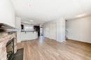 137 Eversyde Boulevard Sw, Calgary, AB  - Indoor Photo Showing Other Room With Fireplace 