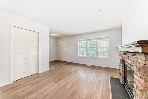 137 Eversyde Boulevard Sw, Calgary, AB - Indoor With Fireplace
