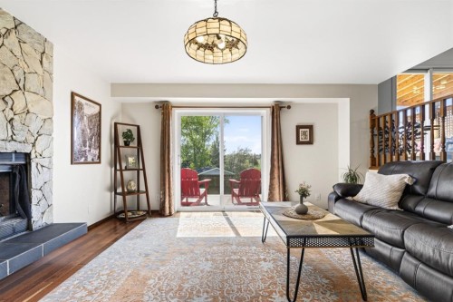 235 Deerview Drive Se, Calgary, AB - Indoor Photo Showing Living Room With Fireplace