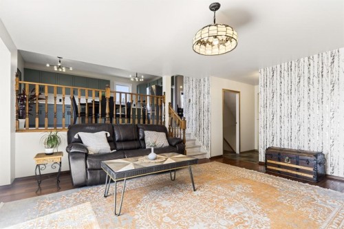 235 Deerview Drive Se, Calgary, AB - Indoor Photo Showing Living Room