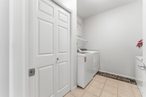 138 Bridlerange Place Sw, Calgary, AB - Indoor Photo Showing Laundry Room