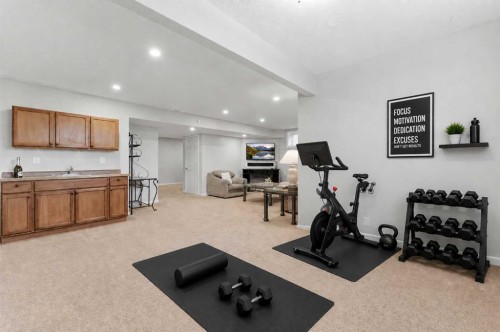 138 Bridlerange Place Sw, Calgary, AB - Indoor Photo Showing Gym Room