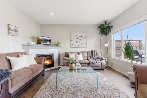 138 Bridlerange Place Sw, Calgary, AB - Indoor Photo Showing Living Room With Fireplace