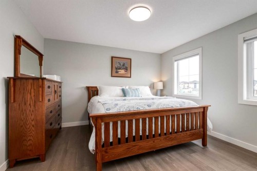 52 Mill Road, Cochrane, AB - Indoor Photo Showing Bedroom