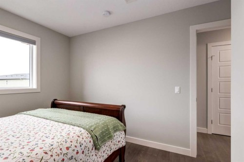 52 Mill Road, Cochrane, AB - Indoor Photo Showing Bedroom