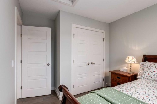 52 Mill Road, Cochrane, AB - Indoor Photo Showing Bedroom