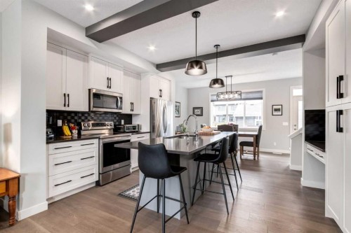 52 Mill Road, Cochrane, AB - Indoor Photo Showing Kitchen With Upgraded Kitchen