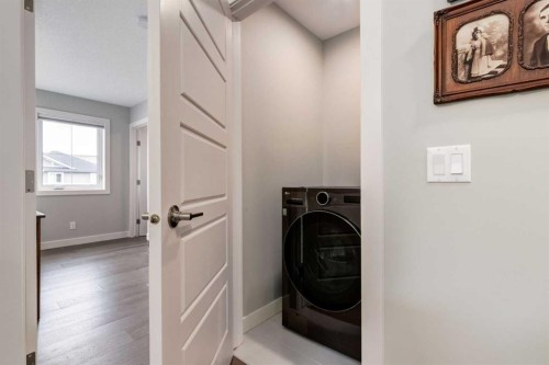 52 Mill Road, Cochrane, AB - Indoor Photo Showing Laundry Room