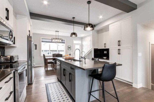 52 Mill Road, Cochrane, AB - Indoor Photo Showing Kitchen With Double Sink With Upgraded Kitchen