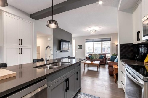52 Mill Road, Cochrane, AB - Indoor Photo Showing Kitchen With Double Sink
