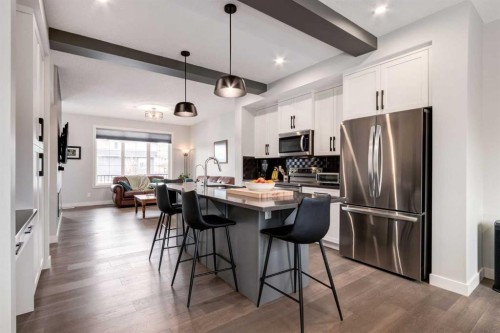 52 Mill Road, Cochrane, AB - Indoor Photo Showing Kitchen With Upgraded Kitchen