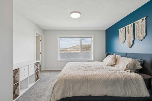 201 Vantage Drive, Cochrane, AB - Indoor Photo Showing Bedroom
