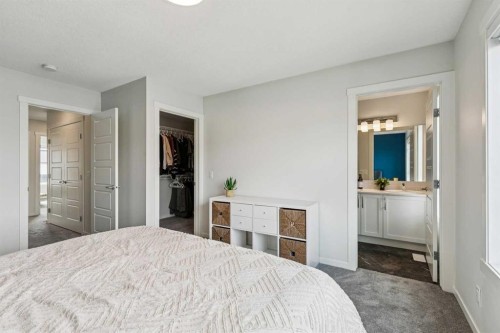 201 Vantage Drive, Cochrane, AB - Indoor Photo Showing Bedroom
