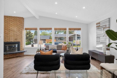 332 Wascana Crescent Se, Calgary, AB - Indoor Photo Showing Living Room With Fireplace