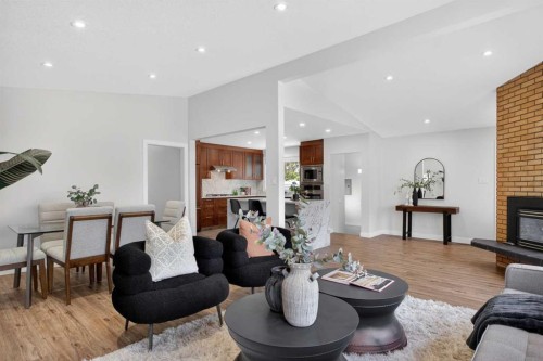 332 Wascana Crescent Se, Calgary, AB - Indoor Photo Showing Living Room With Fireplace