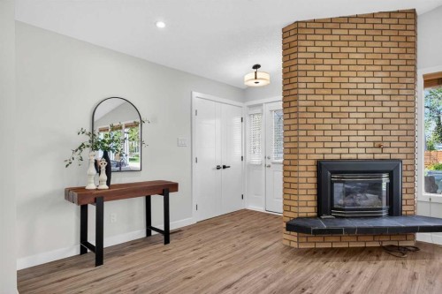332 Wascana Crescent Se, Calgary, AB - Indoor Photo Showing Living Room With Fireplace