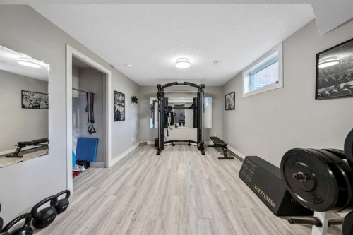6007 34 Street Sw, Calgary, AB - Indoor Photo Showing Gym Room