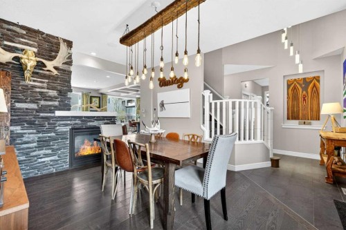 31 Kingston View Se, Airdrie, AB - Indoor Photo Showing Dining Room With Fireplace