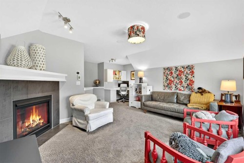 31 Kingston View Se, Airdrie, AB - Indoor Photo Showing Living Room With Fireplace