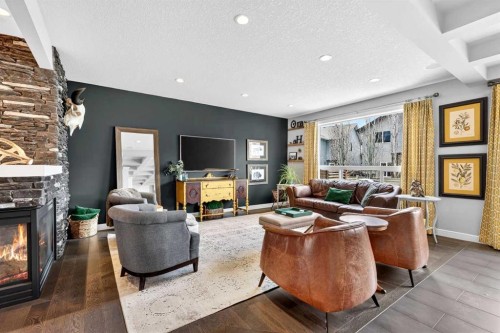 31 Kingston View Se, Airdrie, AB - Indoor Photo Showing Living Room With Fireplace