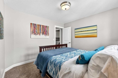 31 Kingston View Se, Airdrie, AB - Indoor Photo Showing Bedroom