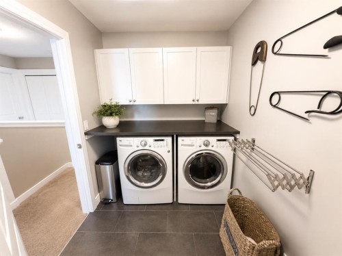31 Kingston View Se, Airdrie, AB - Indoor Photo Showing Laundry Room