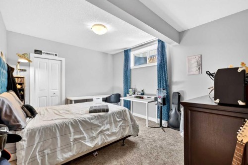 31 Kingston View Se, Airdrie, AB - Indoor Photo Showing Bedroom