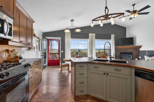 283 Willow Ridge Manor, Diamond Valley, AB - Indoor Photo Showing Kitchen With Double Sink