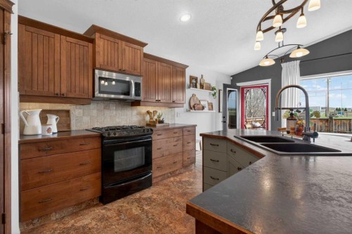 283 Willow Ridge Manor, Diamond Valley, AB - Indoor Photo Showing Kitchen With Double Sink