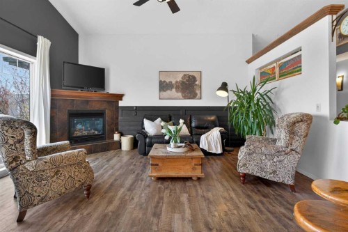 283 Willow Ridge Manor, Diamond Valley, AB - Indoor Photo Showing Living Room With Fireplace
