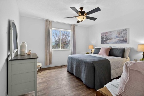 283 Willow Ridge Manor, Diamond Valley, AB - Indoor Photo Showing Bedroom