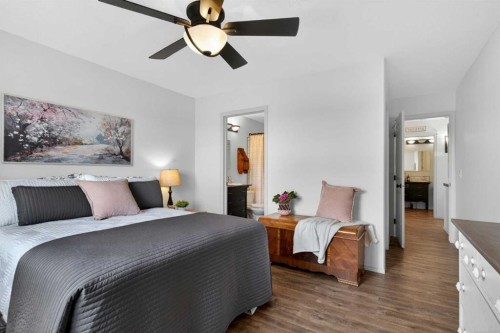 283 Willow Ridge Manor, Diamond Valley, AB - Indoor Photo Showing Bedroom