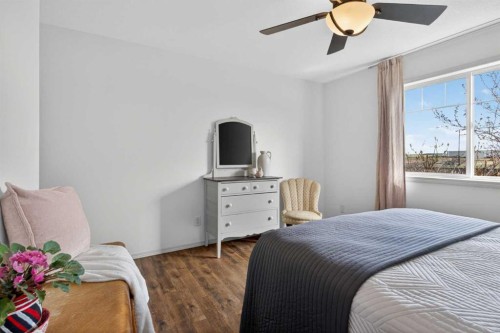 283 Willow Ridge Manor, Diamond Valley, AB - Indoor Photo Showing Bedroom