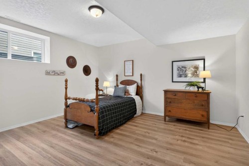 283 Willow Ridge Manor, Diamond Valley, AB - Indoor Photo Showing Bedroom