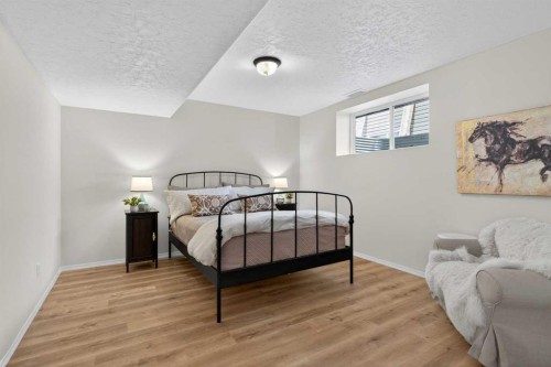 283 Willow Ridge Manor, Diamond Valley, AB - Indoor Photo Showing Bedroom