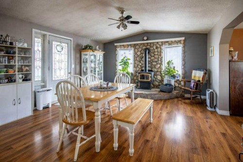 10-33139 Range Road 55, Rural Mountain View County, AB - Indoor Photo Showing Dining Room With Fireplace