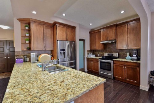 18 Redstone Manor Ne, Calgary, AB - Indoor Photo Showing Kitchen With Double Sink