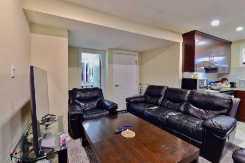 18 Redstone Manor Ne, Calgary, AB - Indoor Photo Showing Living Room