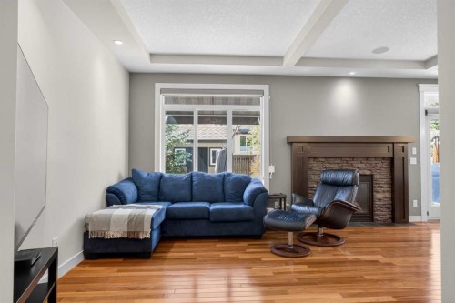 30 Cranarch Circle Se, Calgary, AB - Indoor Photo Showing Other Room With Fireplace