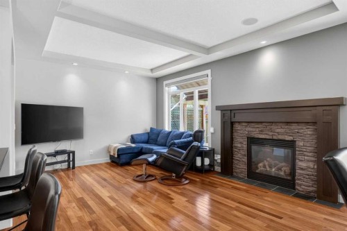30 Cranarch Circle Se, Calgary, AB - Indoor Photo Showing Living Room With Fireplace