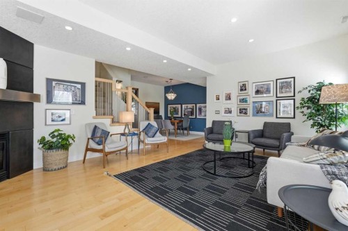 130 Garrison Square Sw, Calgary, AB - Indoor Photo Showing Living Room With Fireplace