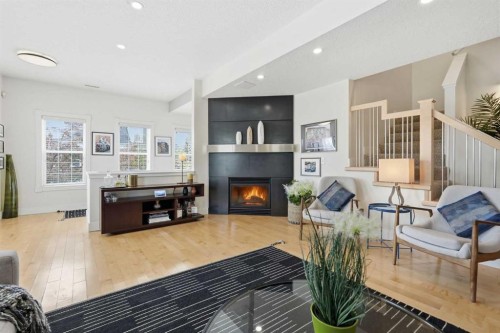 130 Garrison Square Sw, Calgary, AB - Indoor Photo Showing Other Room With Fireplace